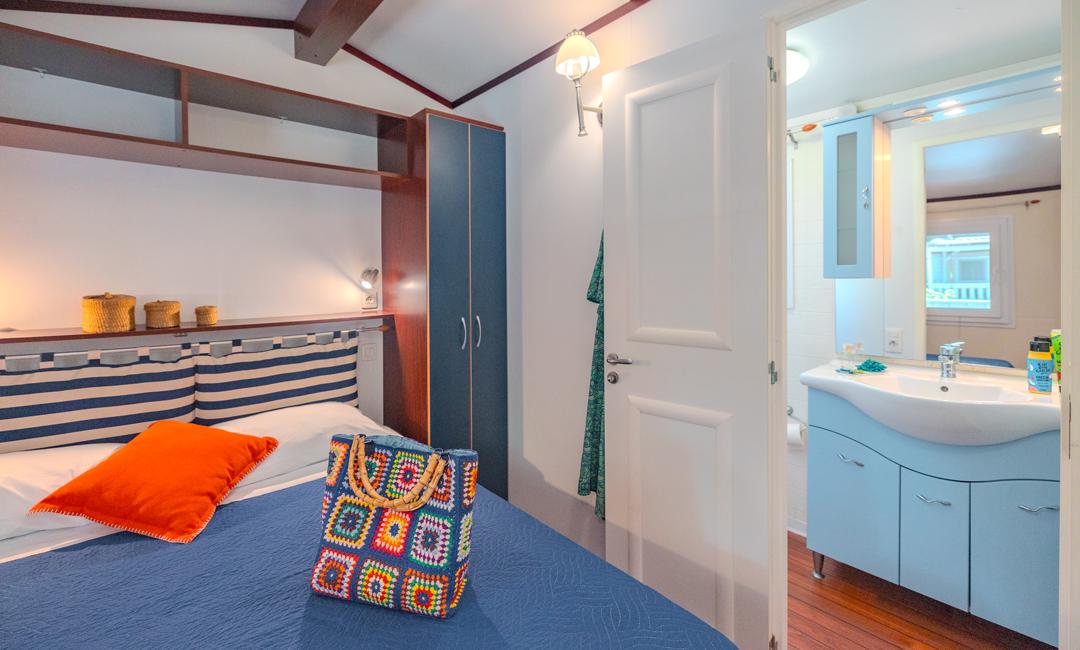Bedroom with en-suite bathroom, cozy and colorful decor.